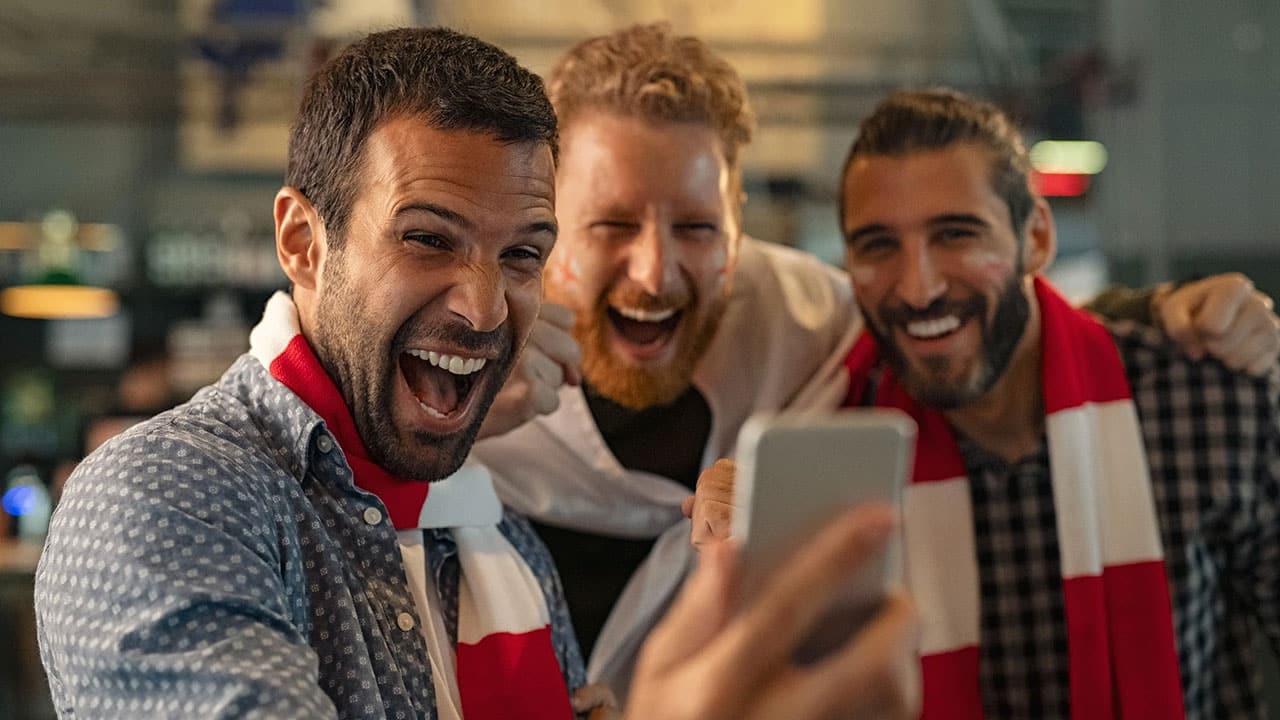StadiumADS Blog - Fans Laughing Smartphone